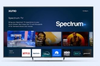 Spectrum TV interface showing streaming apps like Netflix, Disney+, HBO Max, and AMC+ on screen.