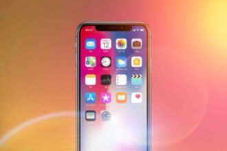 Smartphone glowing with AI visuals, representing OpenAI’s Sora video app growth milestone