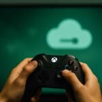 A gamer holding an Xbox controller streaming cloud games – Microsoft ad-supported Xbox Cloud Gaming test